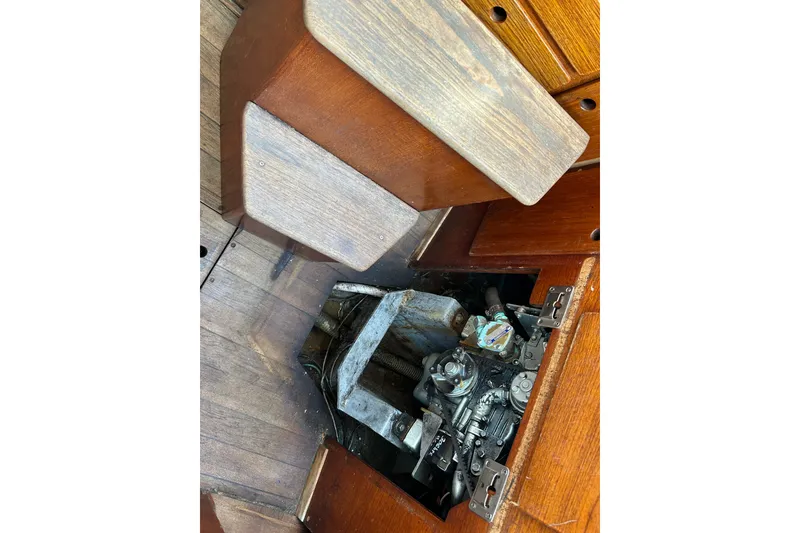 Slide: The Image of Engine compartment of a 1976 Sabre 28 sailboat with wooden interior panels. - 37