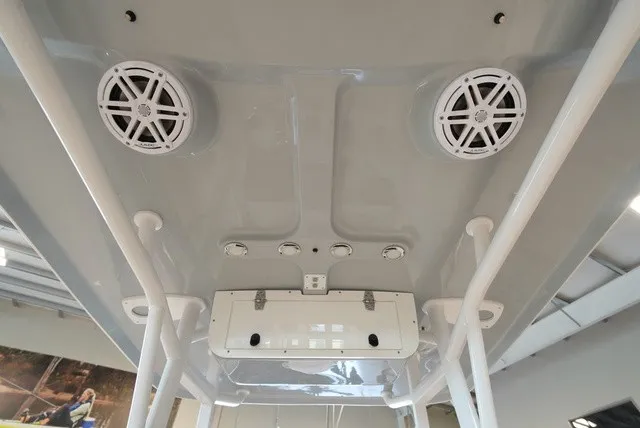 Slide: The Image of The image shows the ceiling of a boat with speakers and lights. - 20