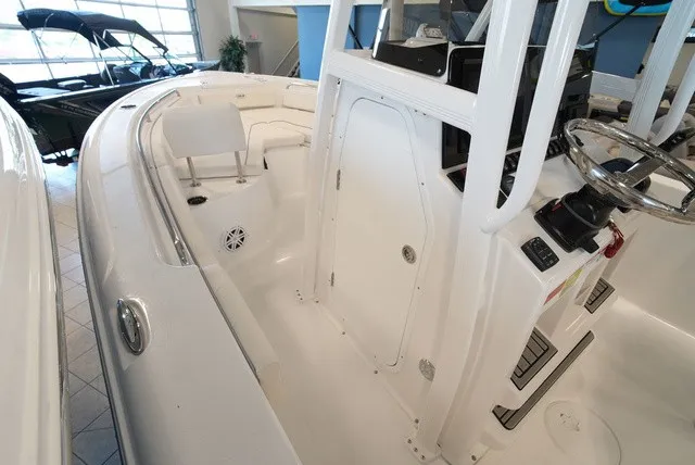 Slide: The Image of The image shows the cockpit of a Sea Hunt Ultra 229 boat with a helm and seating area. - 26