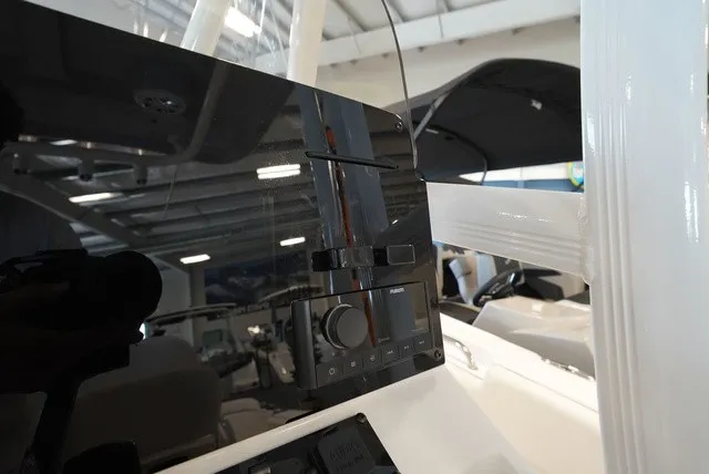 Slide: The Image of The image shows the dashboard of a Sea Hunt Ultra 229 boat with modern controls. - 25