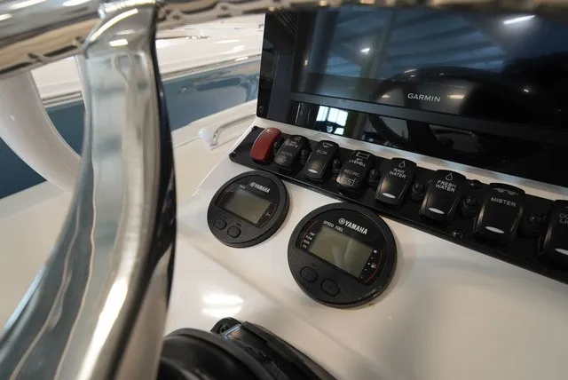 Slide: The Image of Close-up of a Sea Hunt Ultra 229 helm with Yamaha instruments and a Garmin screen. - 23