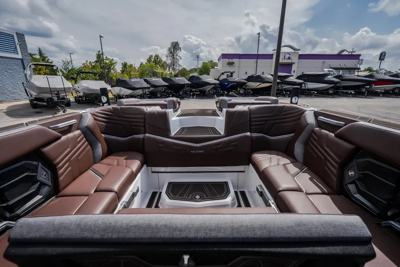 Slide: The Image of Luxurious interior of 2026 Tigé Ultré 25ZX boat with brown leather seating. - 31