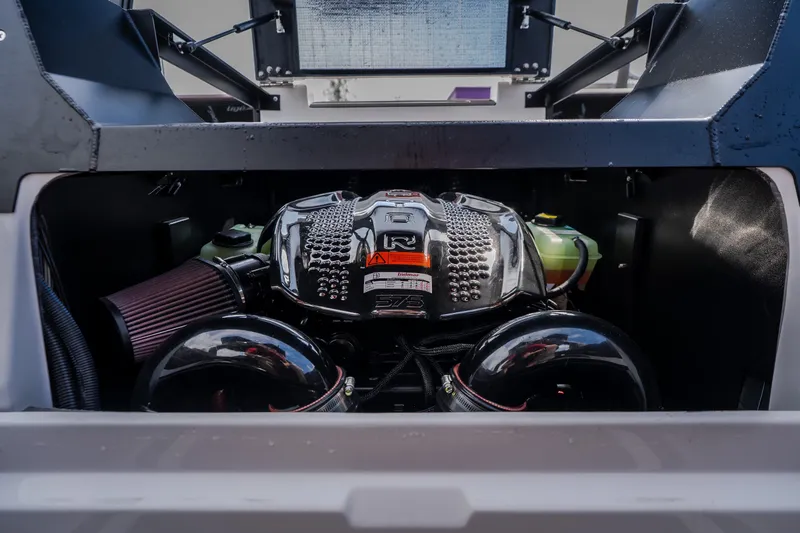 Slide: The Image of Engine compartment of 2026 Tigé Ultré 25ZX boat, showcasing powerful engine components. - 37