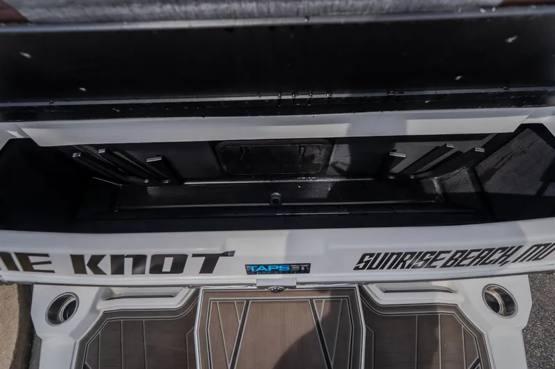 Slide: The Image of 2026 Tigé Ultré 25ZX boat storage compartment, featuring sleek design and ample space. - 21