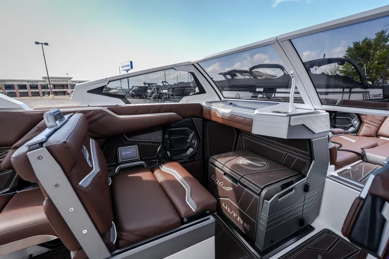 Slide: The Image of Interior of 2026 Tigé Ultré 25ZX boat, featuring luxurious brown seating and modern design. - 46