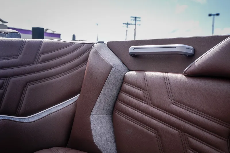 Slide: The Image of 2026 Tigé Ultré 25ZX interior with brown leather seats and modern design. - 33
