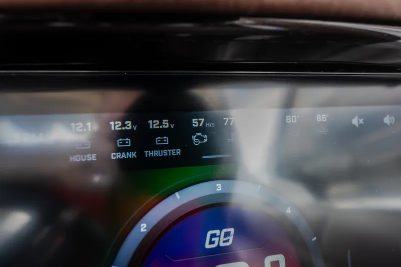 Slide: The Image of Dashboard display of 2026 Tigé Ultré 25ZX boat showing battery voltages and engine hours. - 39