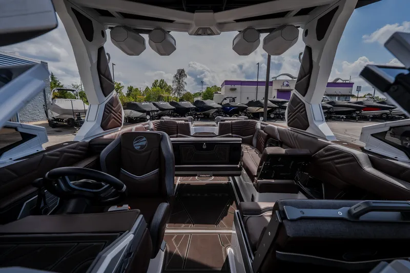Slide: The Image of Interior of 2026 Tigé Ultré 25ZX boat with luxurious seating and modern design. - 30