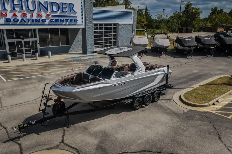 Slide: The Image of 2026 Tigé Ultré 25ZX boat on trailer at Thunder Marine Boating Center. - 58