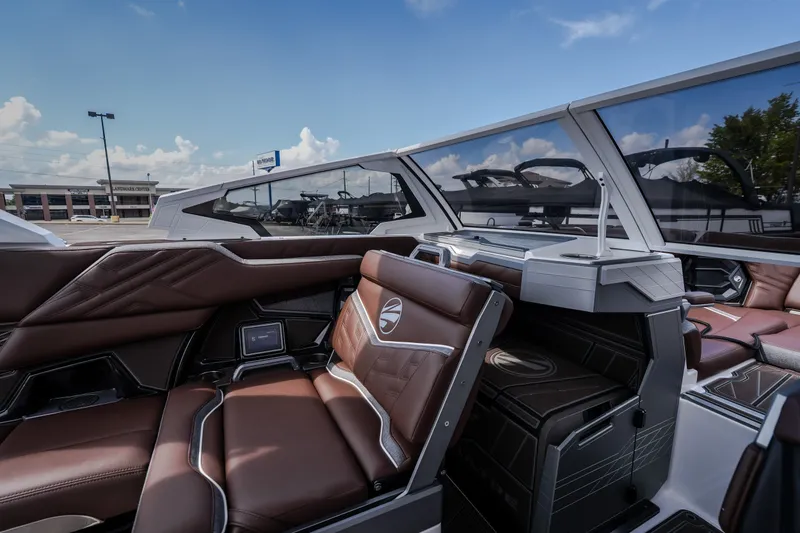 Slide: The Image of Luxurious interior of 2026 Tigé Ultré 25ZX boat with sleek brown seating and modern design. - 47