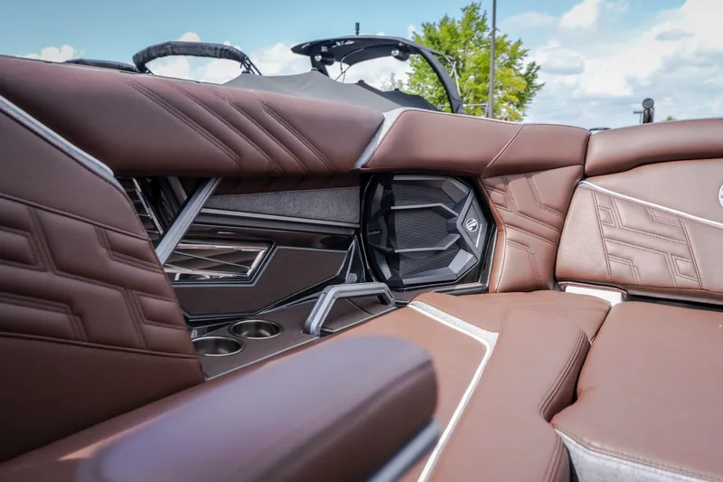 Slide: The Image of Luxurious interior of 2026 Tigé Ultré 25ZX boat with brown leather seating. - 50
