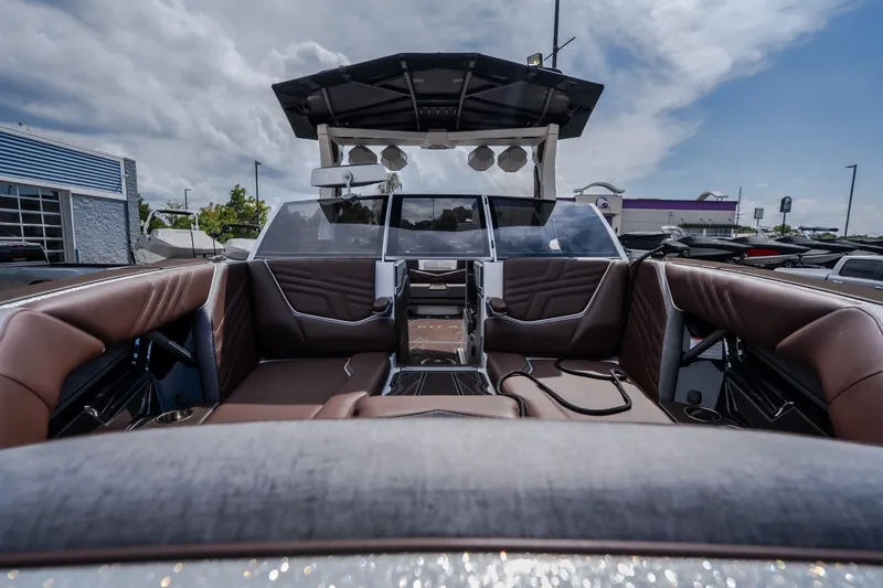Slide: The Image of Interior view of 2026 Tigé Ultré 25ZX boat with luxurious seating and modern design. - 7