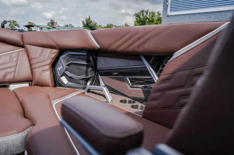 Slide: The Image of Luxurious interior of 2026 Tigé Ultré 25ZX boat with brown leather seating. - 29