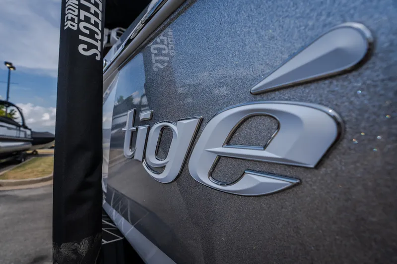 Slide: The Image of Close-up of 2026 Tigé Ultré 25ZX logo on boat exterior. - 17