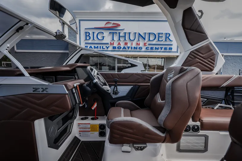 Slide: The Image of 2026 Tigé Ultré 25ZX boat interior at Big Thunder Marine showroom. - 45