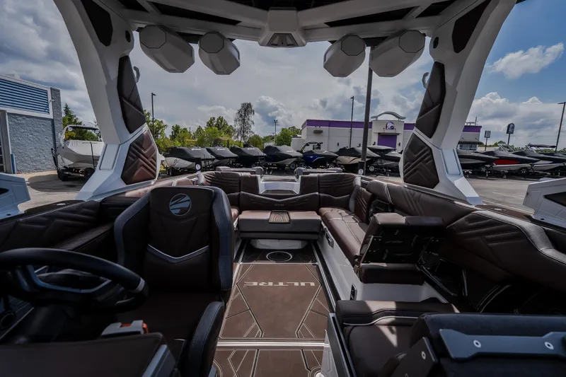 Slide: The Image of 2026 Tigé Ultré 25ZX boat interior with luxurious seating and modern design. - 55