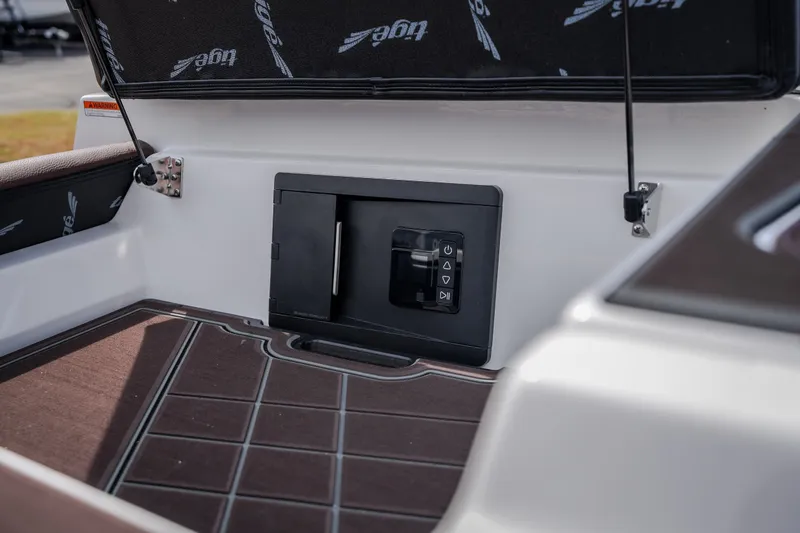 Slide: The Image of 2026 Tigé Ultré 25ZX boat interior with control panel and cushioned seating. - 35
