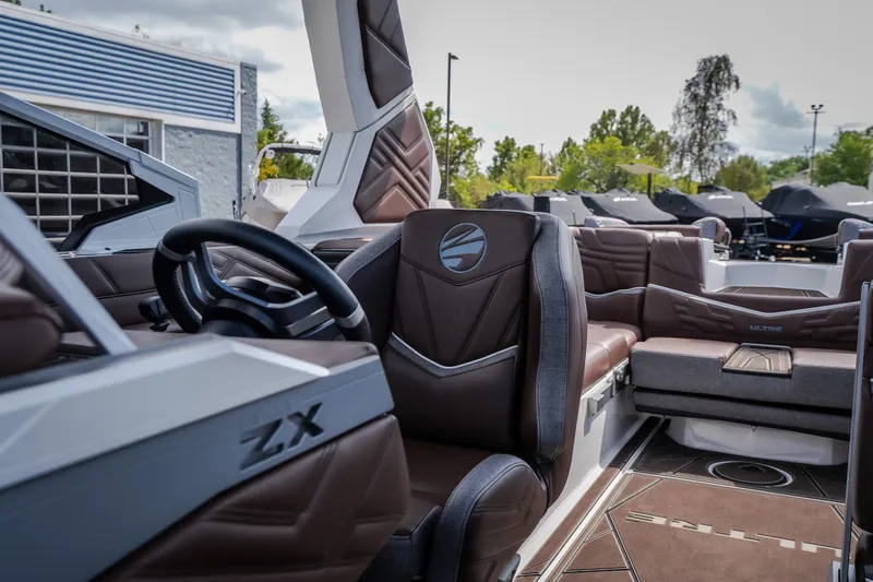 Slide: The Image of 2026 Tigé Ultré 25ZX boat interior with luxurious seating and modern design. - 51