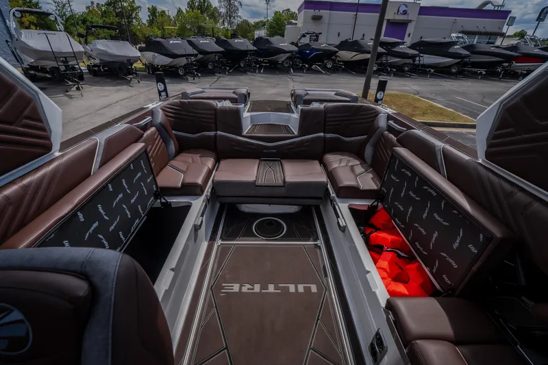 Slide: The Image of Luxurious interior of 2026 Tigé Ultré 25ZX boat with brown leather seating. - 26