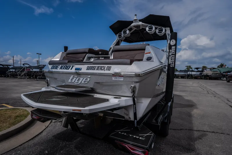 Slide: The Image of 2026 Tigé Ultré 25ZX boat displayed outdoors, showcasing sleek design and modern features. - 10