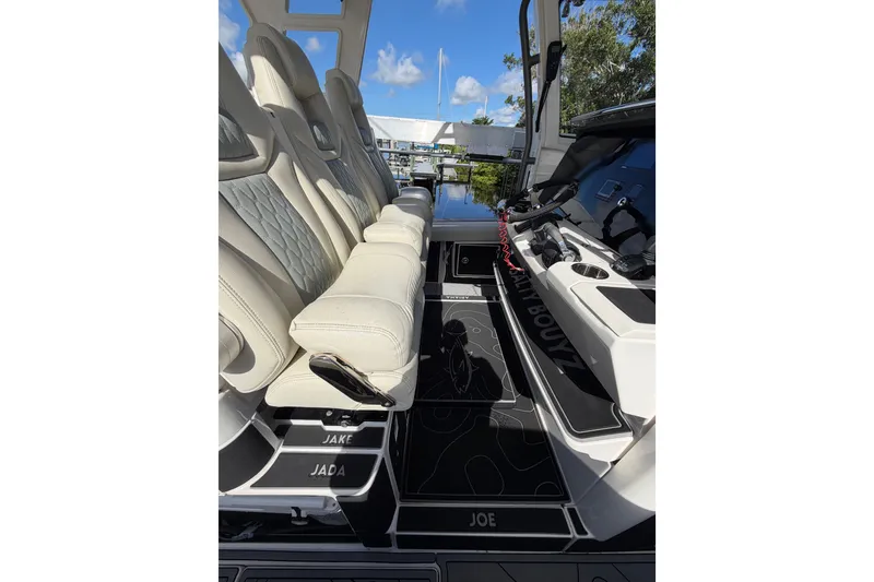 Slide: The Image of 2021 Solace 345CC boat interior with luxurious seating and modern dashboard. - 26