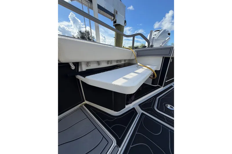 Slide: The Image of 2021 Solace 345CC boat interior with cushioned seating and sleek design. - 41