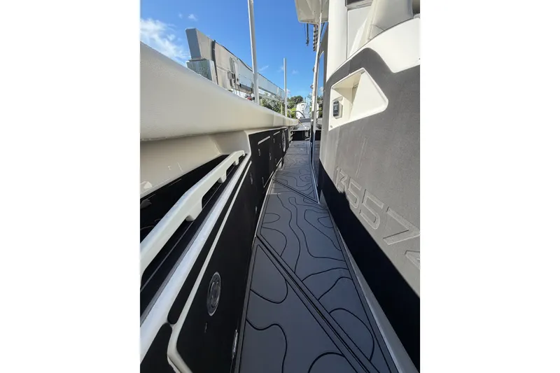 Slide: The Image of Side view of a 2021 Solace 345CC boat with sleek design and modern features. - 27
