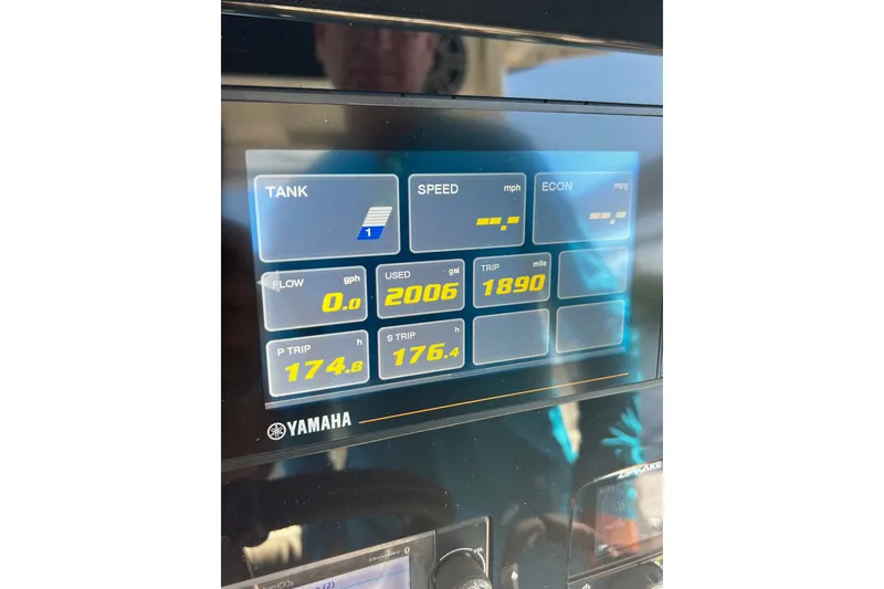 Slide: The Image of Dashboard display of a 2021 Solace 345CC boat showing fuel and trip data. - 51