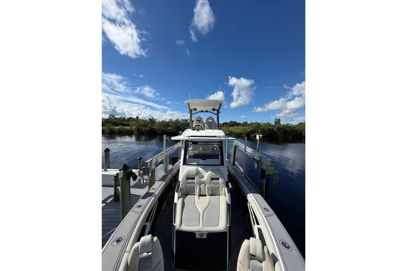 Slide: The Image of 2021 Solace 345CC boat docked under clear blue sky. - 17