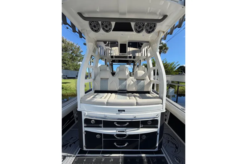 Slide: The Image of 2021 Solace 345CC boat interior with luxurious seating and storage drawers. - 35