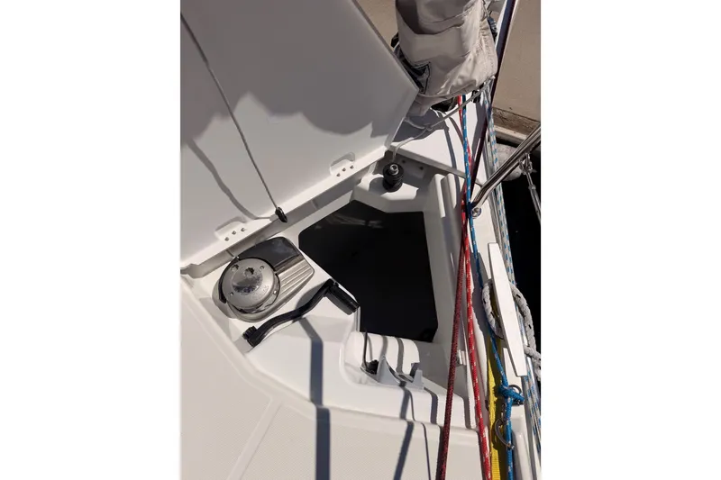 Slide: The Image of 2024 Jeanneau Sun Odyssey 380 sailboat deck with open hatch and winch. - 16