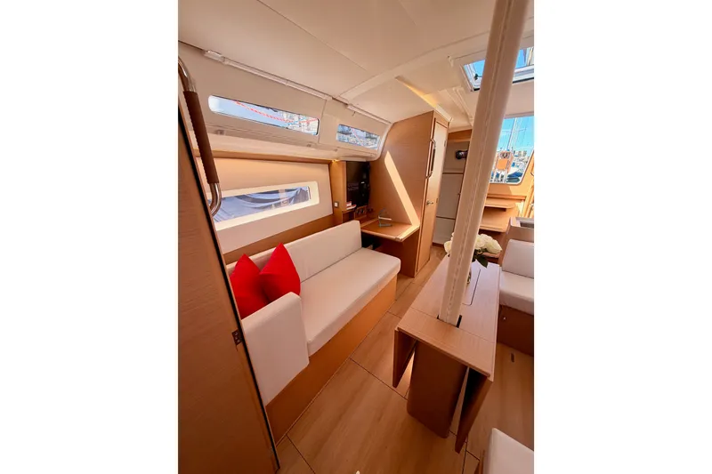 Slide: The Image of Interior of 2024 Jeanneau Sun Odyssey 380 yacht, featuring modern seating and natural light. - 71