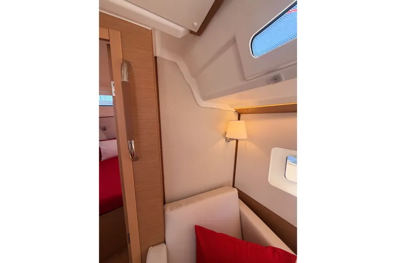 Slide: The Image of Interior of 2024 Jeanneau Sun Odyssey 380 yacht, featuring cozy seating and elegant lighting. - 65