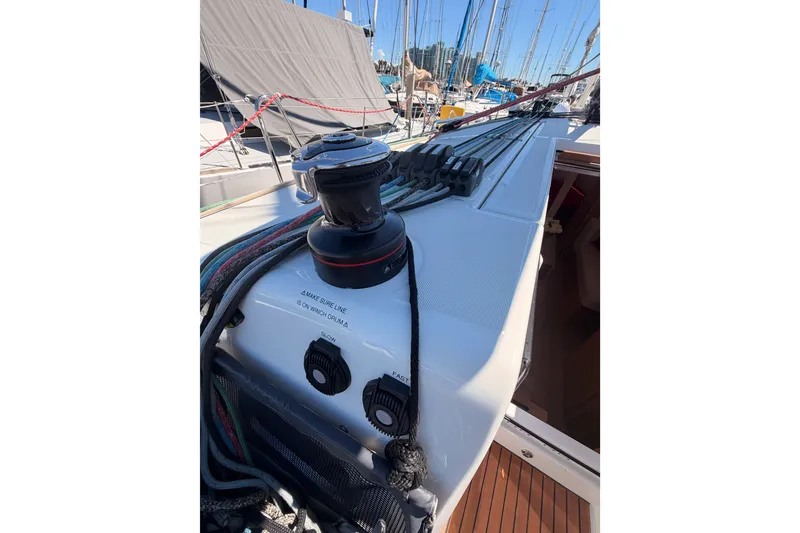 Slide: The Image of 2024 Jeanneau Sun Odyssey 380 sailboat deck with winch and ropes. - 39