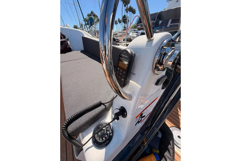 Slide: The Image of 2024 Jeanneau Sun Odyssey 380 helm with navigation instruments and compass. - 34