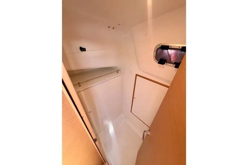 Slide: The Image of Interior of 2024 Jeanneau Sun Odyssey 380 sailboat, featuring a compact, well-lit cabin space. - 53