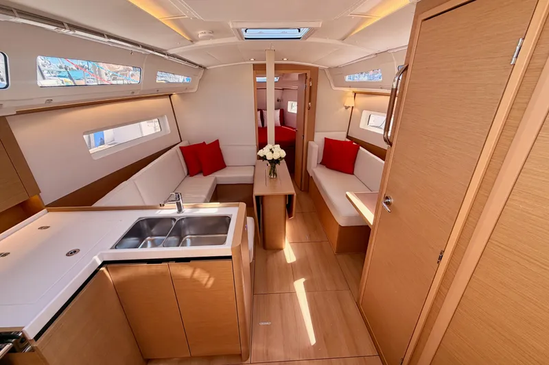Slide: The Image of Luxurious interior of 2024 Jeanneau Sun Odyssey 380 sailboat with modern design and cozy seating. - 42