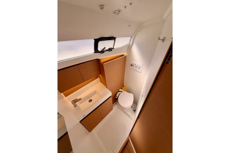 Slide: The Image of Modern bathroom interior of 2024 Jeanneau Sun Odyssey 380 yacht, featuring sleek design and compact layout. - 57