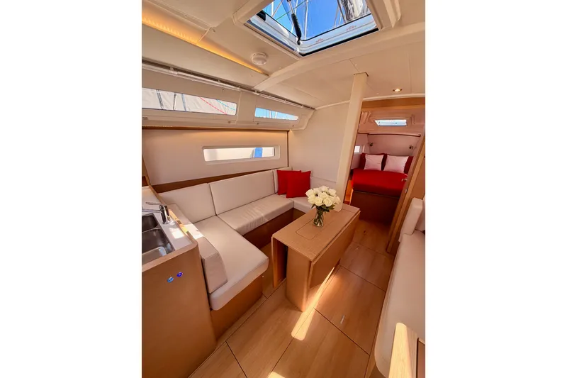 Slide: The Image of Luxurious interior of 2024 Jeanneau Sun Odyssey 380 yacht with elegant seating and decor. - 59