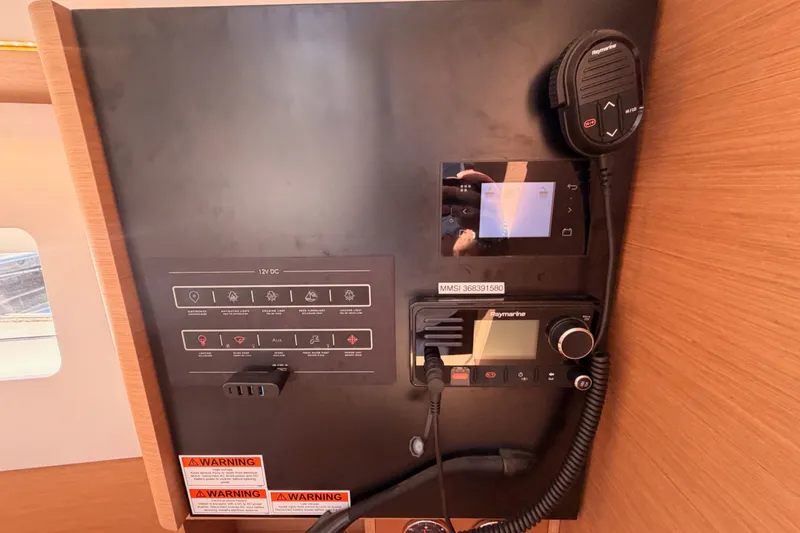 Slide: The Image of Control panel of 2024 Jeanneau Sun Odyssey 380 yacht with navigation and communication equipment. - 62