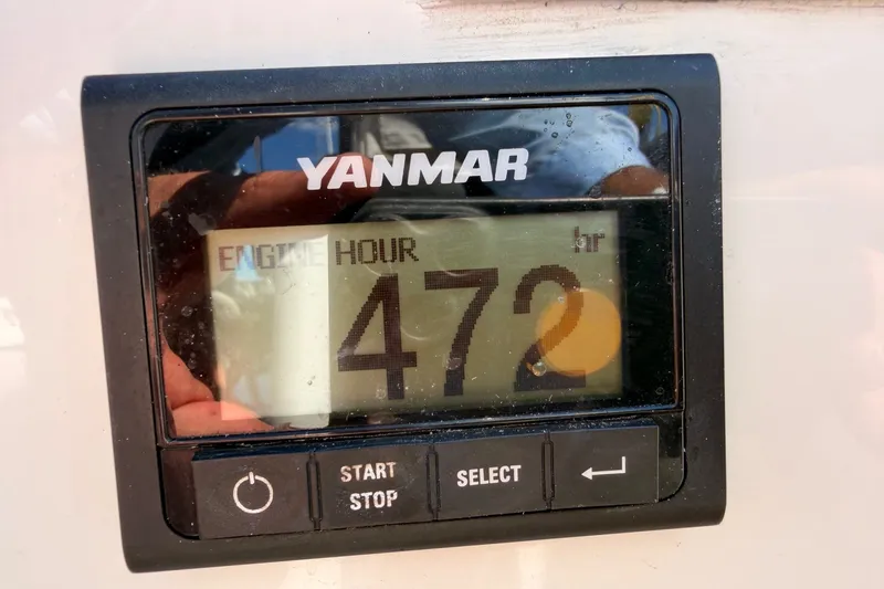 Slide: The Image of Yanmar engine hour meter displaying 472 hours on Jeanneau Sun Odyssey 380, 2024 model. - 83