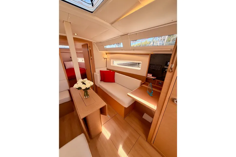 Slide: The Image of Interior of 2024 Jeanneau Sun Odyssey 380 yacht, featuring elegant seating and modern design. - 60