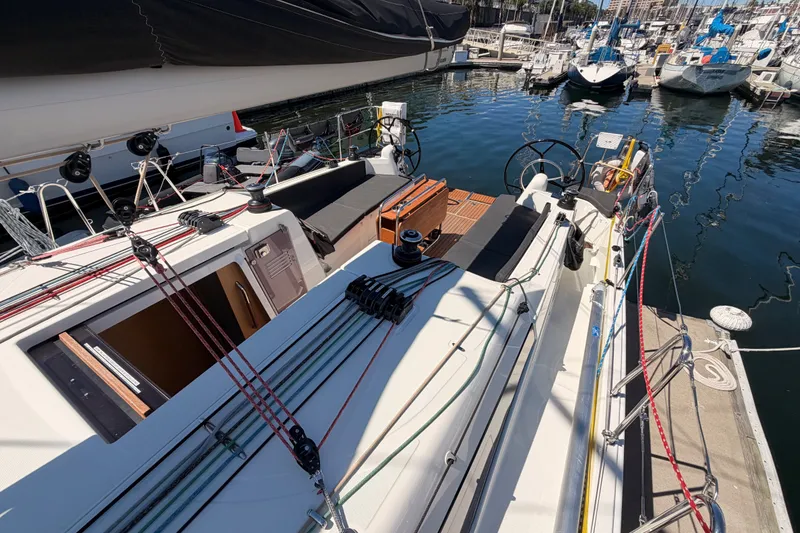 Slide: The Image of 2024 Jeanneau Sun Odyssey 380 sailboat docked, showcasing deck and cockpit area. - 22