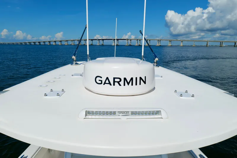 Slide: The Image of Invincible 33 Catamaran 2022 with Garmin equipment, cruising under a clear blue sky. - 39
