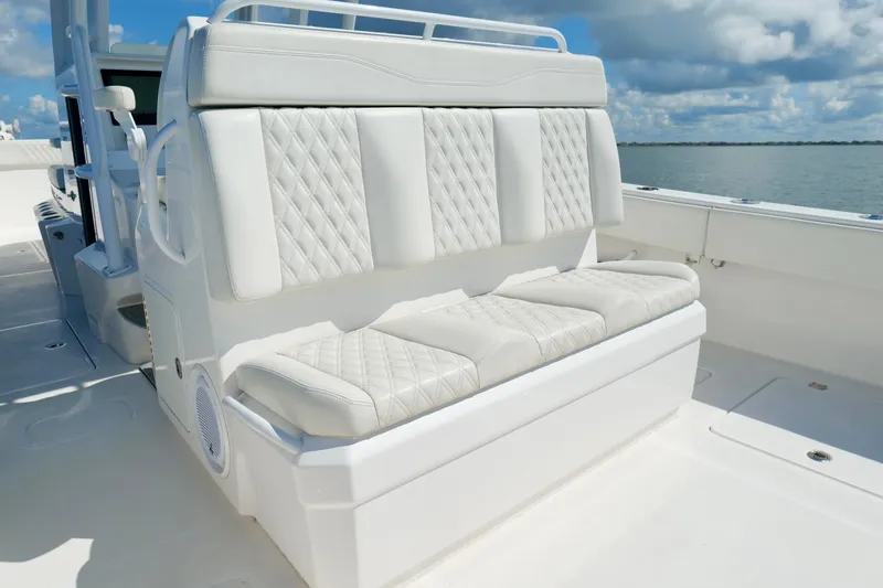 Slide: The Image of Luxurious seating on 2022 Invincible 33 Catamaran, featuring diamond-stitched upholstery. - 23