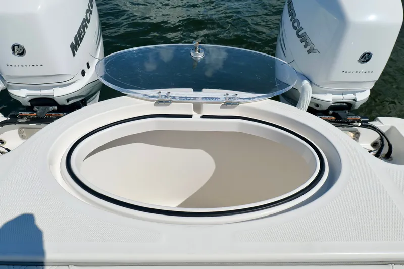 Slide: The Image of 2022 Invincible 33 Catamaran with dual Mercury outboard engines and open livewell. - 27