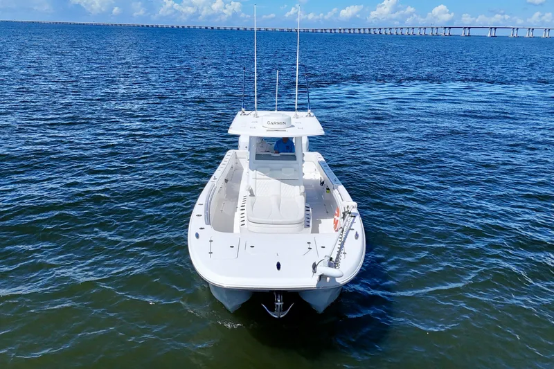 Slide: The Image of 2022 Invincible 33 Catamaran on open water, showcasing sleek design and advanced features. - 2
