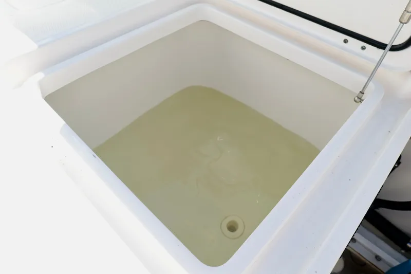 Slide: The Image of Livewell on 2022 Invincible 33 Catamaran, filled with water, showcasing fishing utility. - 30