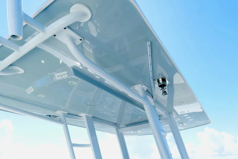 Slide: The Image of 2022 Invincible 33 Catamaran T-top structure against a clear blue sky. - 20