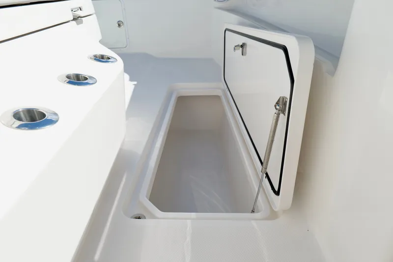 Slide: The Image of Open storage compartment on 2022 Invincible 33 Catamaran boat deck. - 43